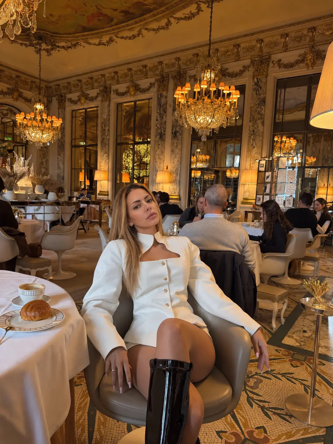 White blazer look in a Parisian tea room